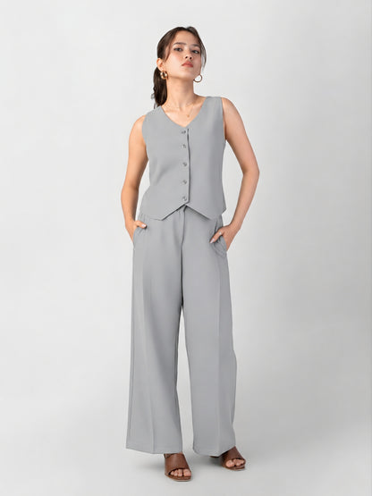 Grey flare trousers that need no alterations for petite women, worn with matching waistcoat