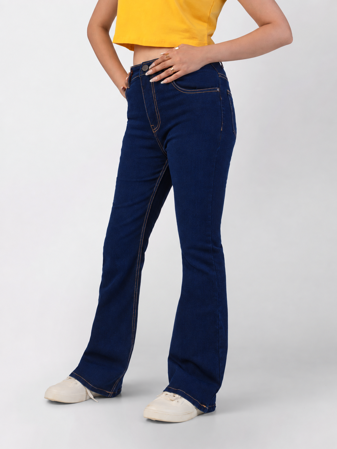 Dark blue bootcut jeans, high-waisted with front pockets, premium stretch denim