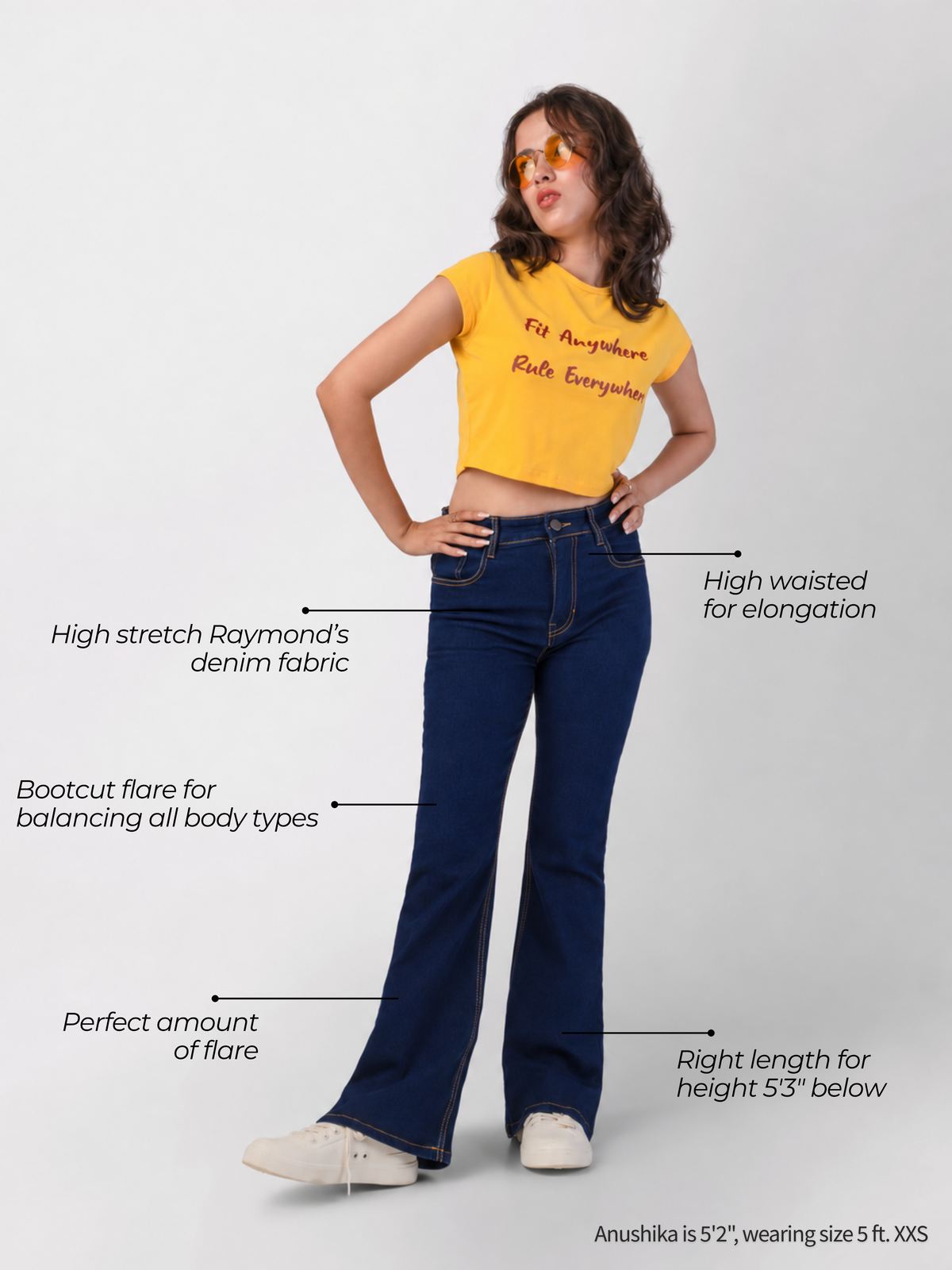 High-waisted dark blue bootcut jeans with flare, right length for petite women